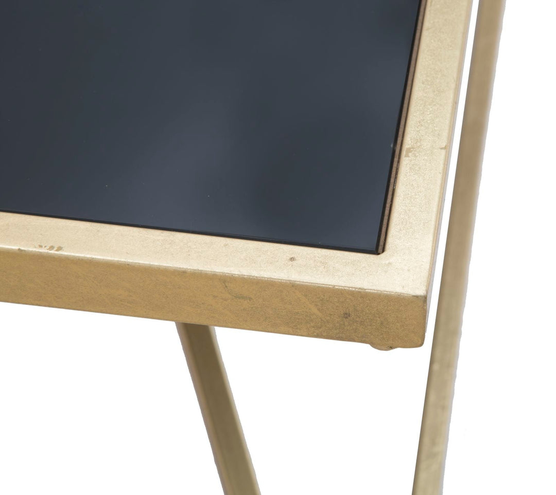 Mesa de centro de metal dorado y negro con patas piramidales