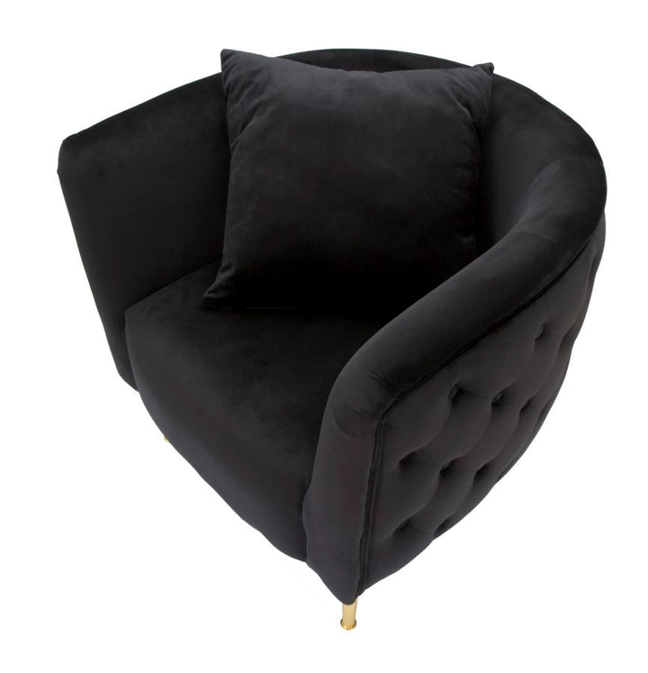 Sillón de terciopelo negro con patas de metal dorado