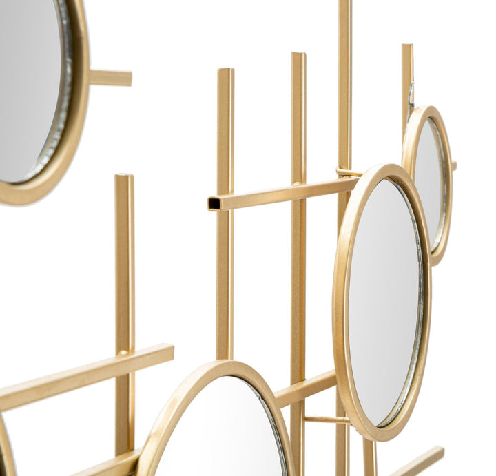 Pequeños espejos de pared redondos de metal dorado