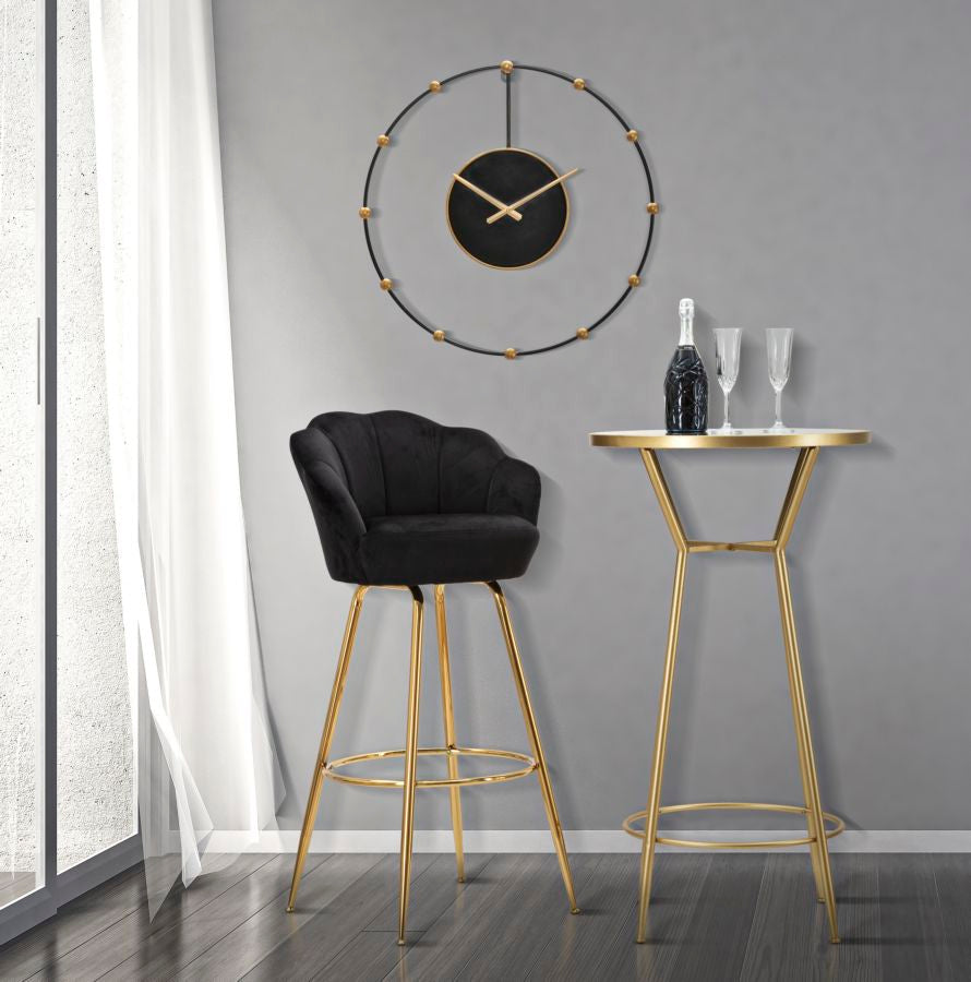 Taburete de terciopelo negro con patas de metal dorado