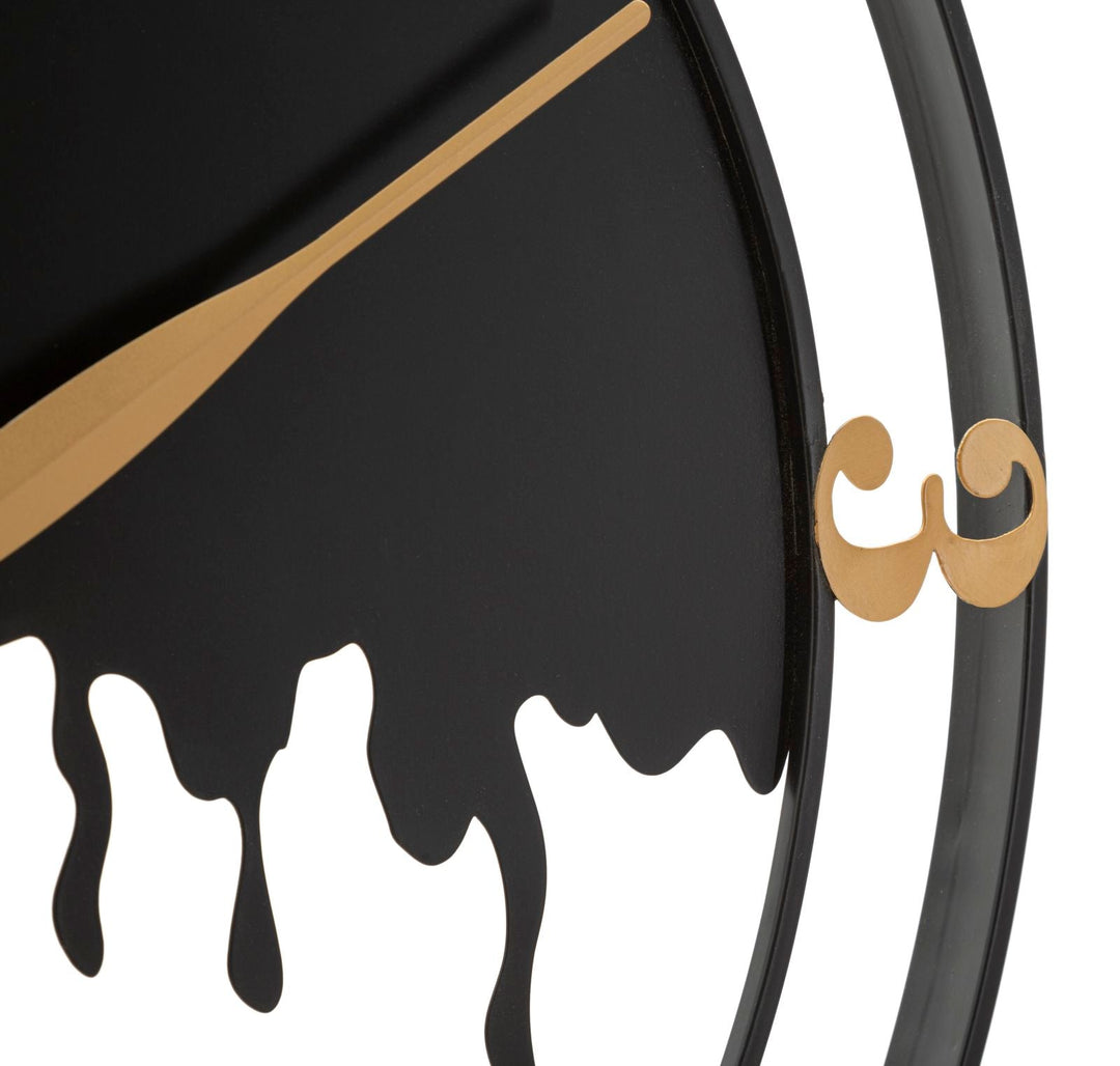 Reloj de pared moderno de metal dorado y negro