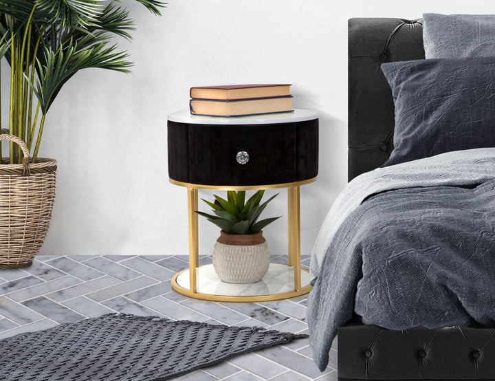 Mesita de noche dorada y negra con tapa de mármol