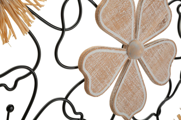 Decoración de pared de metal y madera con flores