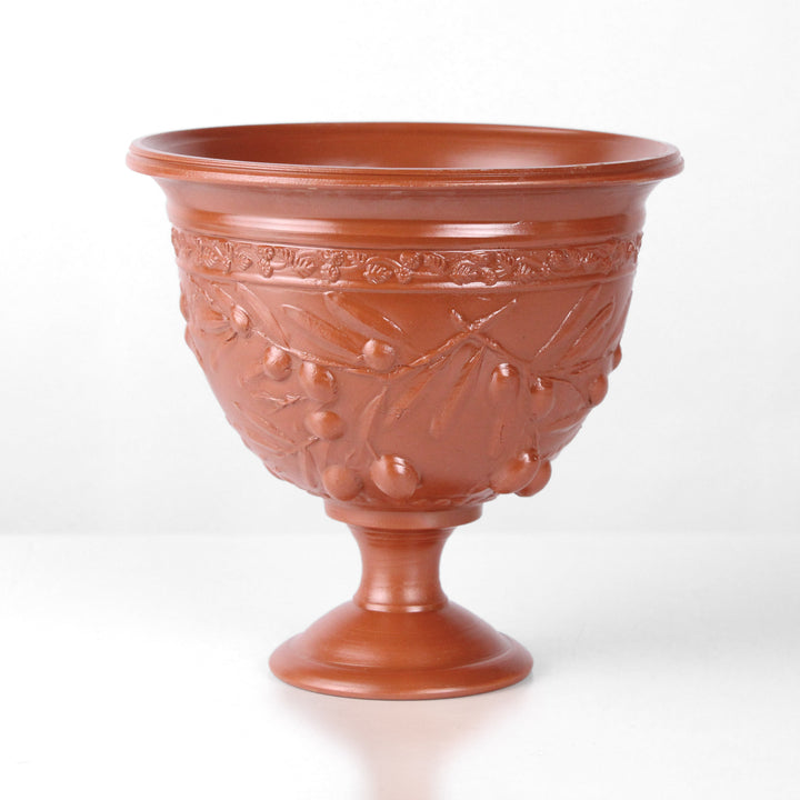 Copa de cerámica romana con relieve de olivos