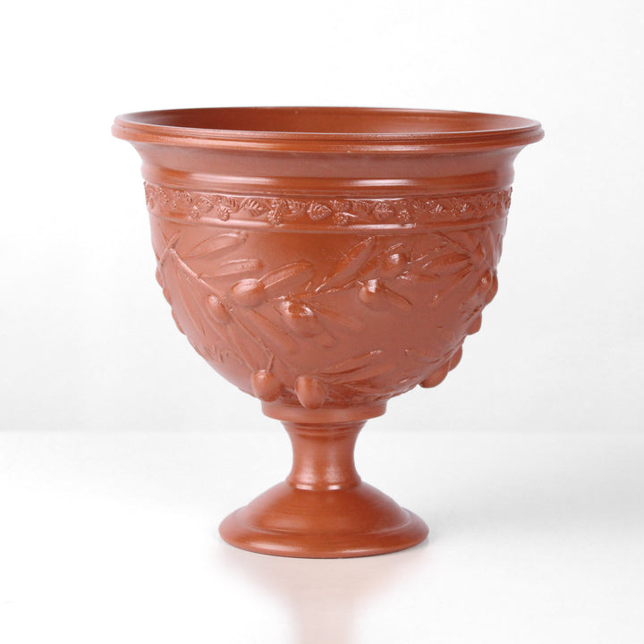 Copa de cerámica romana con relieve de olivos