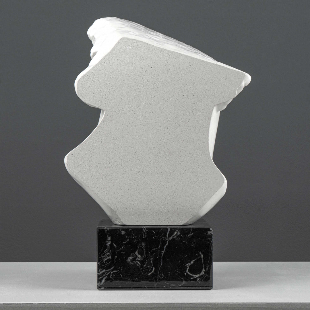 Escultura Fragmento del Busto de Apolo sobre Base de Mármol Negro (Cabeza Colosal de un Joven)