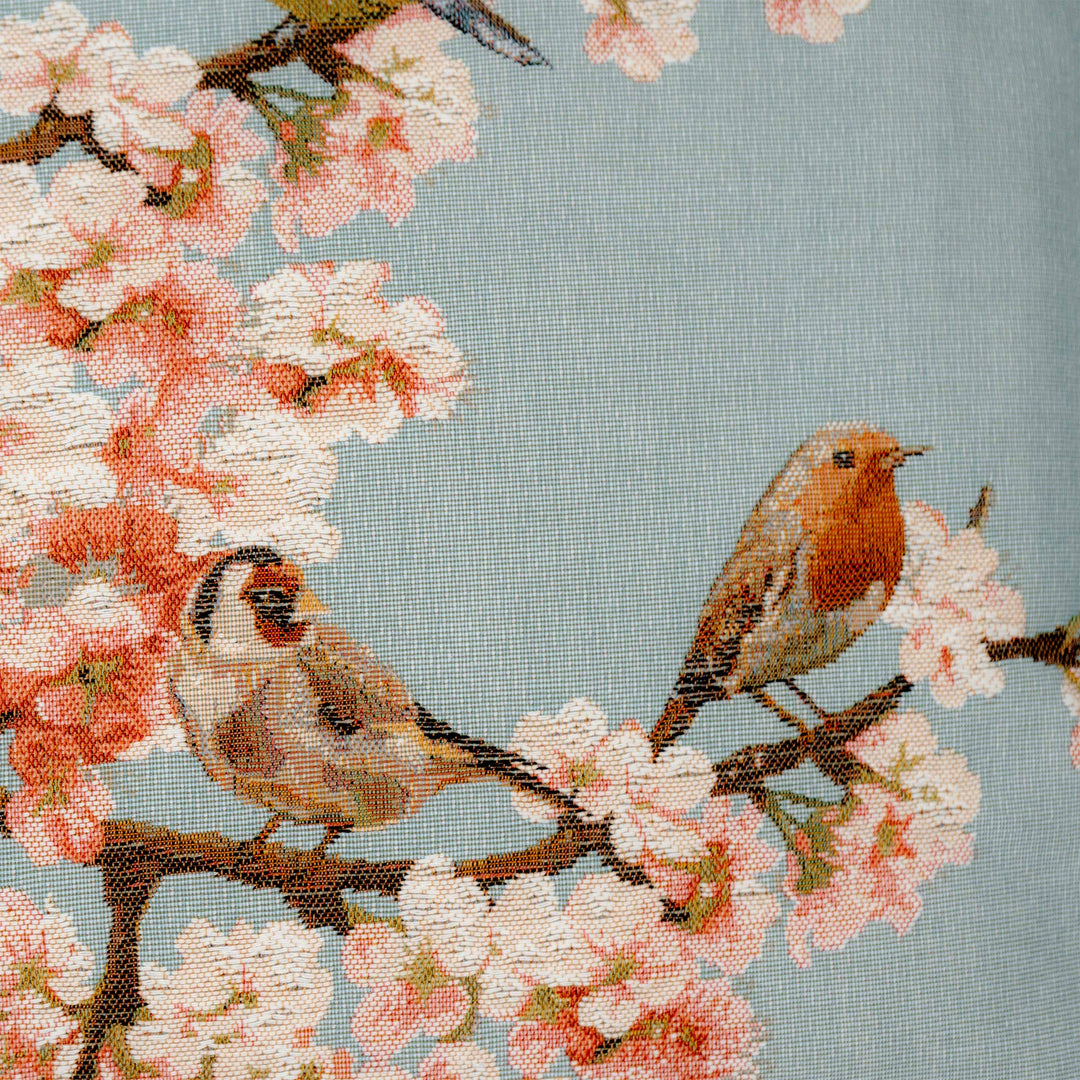 Cojín azul – pájaros y flores de cerezo (tejido jacquard)