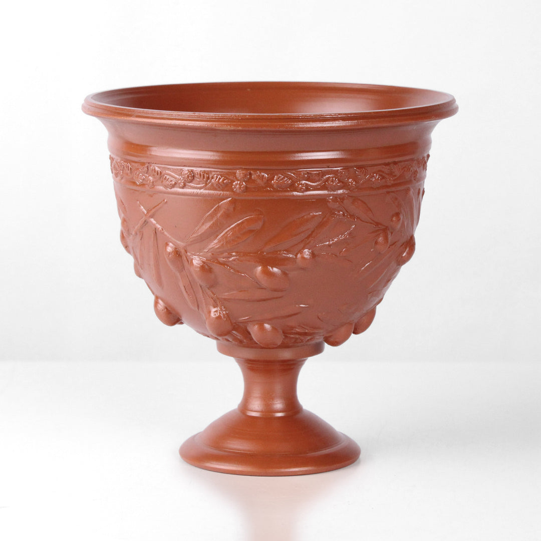 Copa de cerámica romana con relieve de olivos