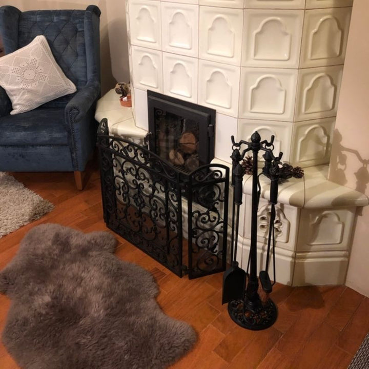 Juego de herramientas para chimenea en hierro fundido con remates de piña
